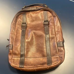Fossil men’s cowhide leather backpack perfect for school, office, or travel.